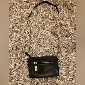 Rebecca Minkoff black and gold crossbody bag. Used but great condition.